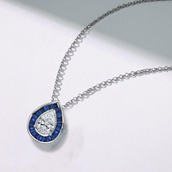 Pear Cut Blue Sapphire Halo Pendant Necklace in Sterling Silver