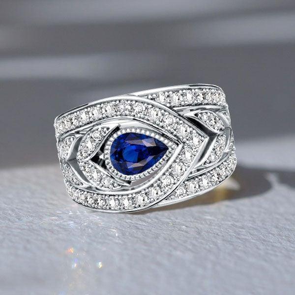 Pear Cut Blue Sapphire Wedding Band in 925 Sterling Silver with Rhodium Plating