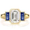 Affordable Emerald Cut Three Stone Engagement Ring with Gold Plated Bezel Setting