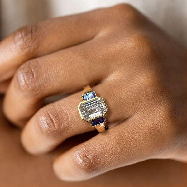 Affordable Emerald Cut Three Stone Engagement Ring with Gold Plated Bezel Setting