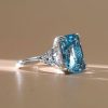 Three Stone Radiant Cut Blue Topaz Engagement Ring in Sterling Silver with Rhodium Plating