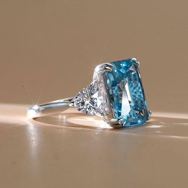 Three Stone Radiant Cut Blue Topaz Engagement Ring in Sterling Silver with Rhodium Plating