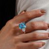 Three Stone Radiant Cut Blue Topaz Engagement Ring in Sterling Silver with Rhodium Plating