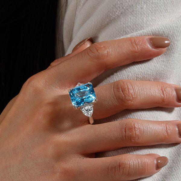 Three Stone Radiant Cut Blue Topaz Engagement Ring in Sterling Silver with Rhodium Plating