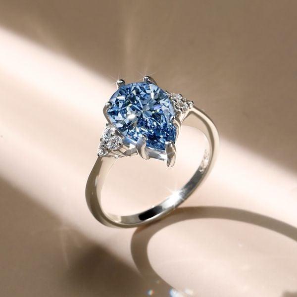 Pear Shaped Blue Topaz Engagement Ring in 925 Sterling Silver with Rhodium Finish