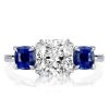 Three Stone Blue Topaz Engagement Ring in Rhodium Plated Sterling Silver