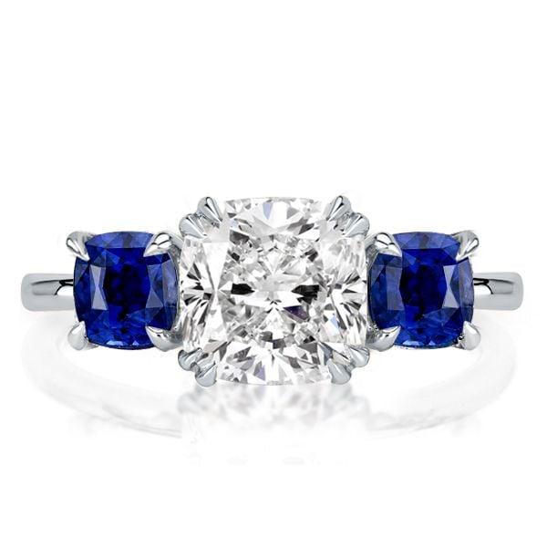 Three Stone Blue Topaz Engagement Ring in Rhodium Plated Sterling Silver