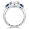 Three Stone Blue Topaz Engagement Ring in Rhodium Plated Sterling Silver
