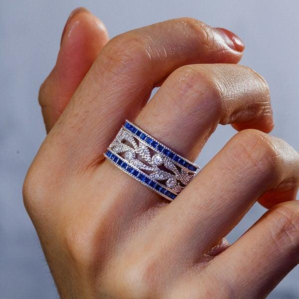 Round Cut White & Blue Sapphire Wedding Band in 925 Sterling Silver