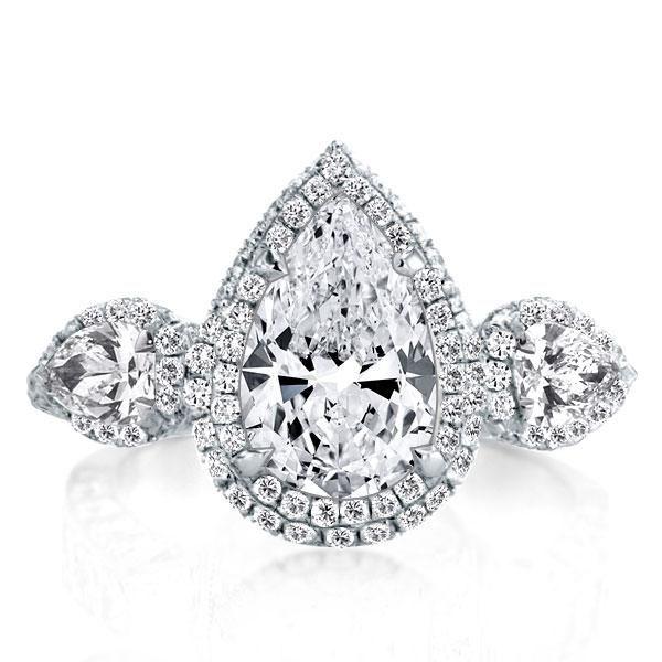 Pear Cut Three Stone Engagement Ring in Sterling Silver