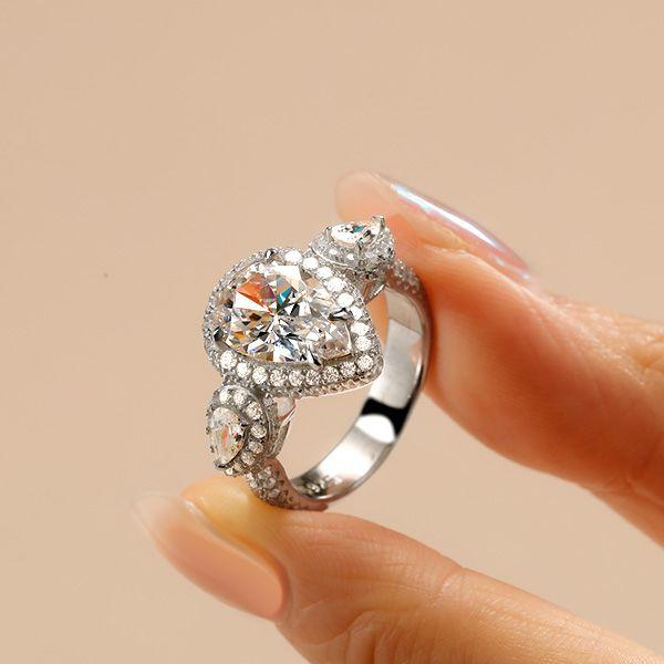 Pear Cut Three Stone Engagement Ring in Sterling Silver
