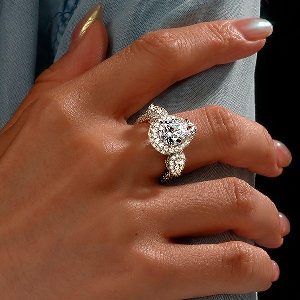 Pear Cut Three Stone Engagement Ring in Sterling Silver