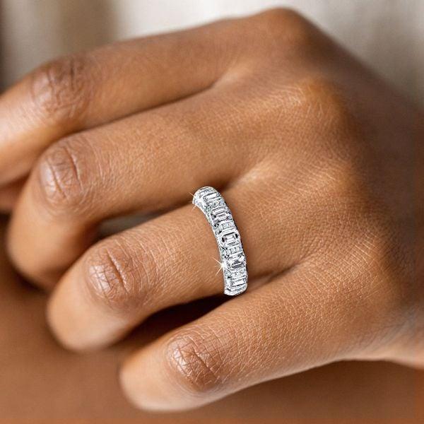 Emerald Cut Created White Sapphire Eternity Wedding Band in Rhodium Plated Sterling Silver
