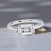 Emerald Cut White Sapphire Engagement Ring in Rhodium Plated Sterling Silver