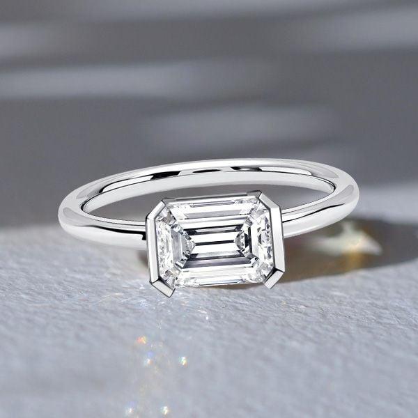 Emerald Cut White Sapphire Engagement Ring in Rhodium Plated Sterling Silver