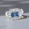 East West Emerald Cut Blue Topaz Engagement Ring in Sterling Silver
