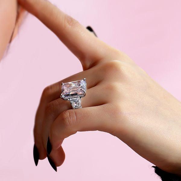 Classic Three Stone Emerald Cut Engagement Ring in Rhodium Plated Sterling Silver