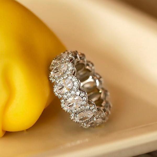 Oval Halo Eternity Wedding Band in Rhodium-Plated Sterling Silver