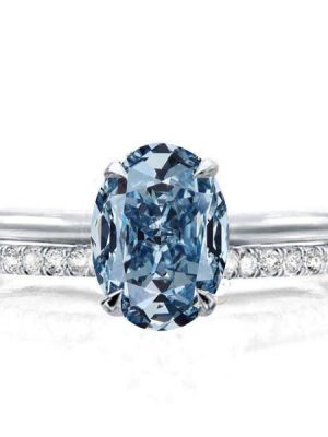 Oval Cut Blue Topaz Solitaire Engagement Ring Set in Rhodium Plated Sterling Silver
