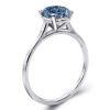 Oval Cut Blue Topaz Solitaire Engagement Ring Set in Rhodium Plated Sterling Silver