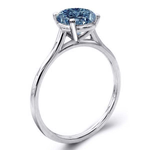 Oval Cut Blue Topaz Solitaire Engagement Ring Set in Rhodium Plated Sterling Silver