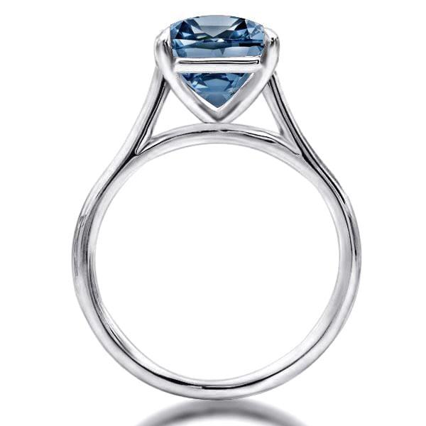 Oval Cut Blue Topaz Solitaire Engagement Ring Set in Rhodium Plated Sterling Silver