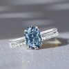 Oval Cut Blue Topaz Solitaire Engagement Ring Set in Rhodium Plated Sterling Silver