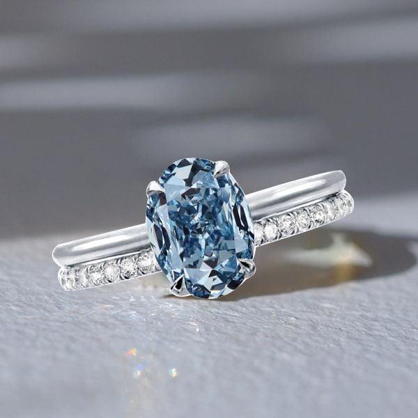 Oval Cut Blue Topaz Solitaire Engagement Ring Set in Rhodium Plated Sterling Silver