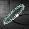 Bezel Setting Cushion Cut Emerald Tennis Bracelet in Rhodium Plated Sterling Silver