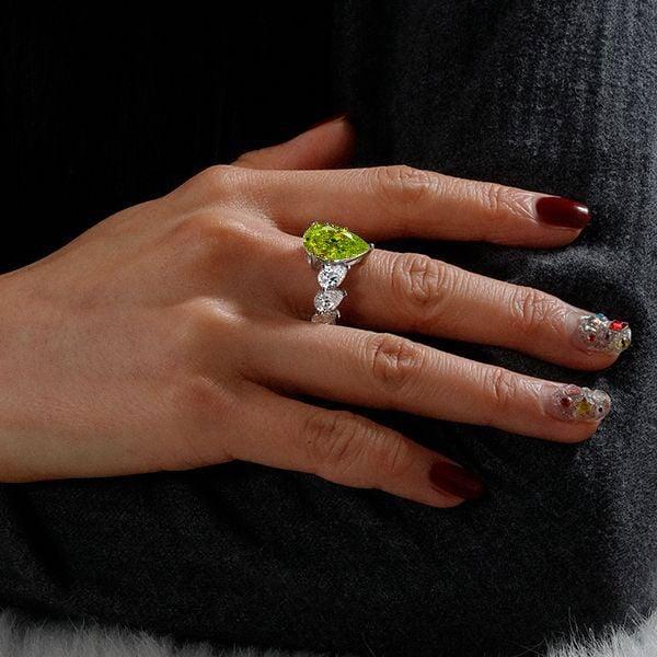 Pear Shaped Peridot Engagement Ring in Rhodium Plated Sterling Silver