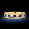 1.76 CT. TW. Channel Emerald Cut Blue Sapphire Eternity Band Ring in 18K Gold Plated Sterling Silver