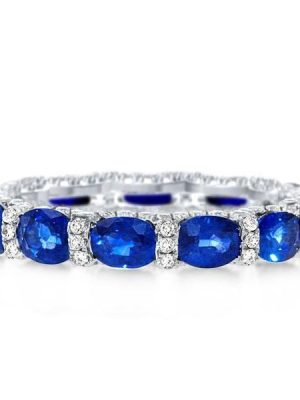 Oval Created Sapphire Wedding Band in Sterling Silver