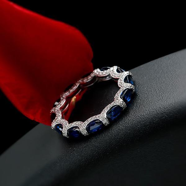 Oval Created Sapphire Wedding Band in Sterling Silver