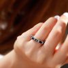 Oval Created Sapphire Wedding Band in Sterling Silver