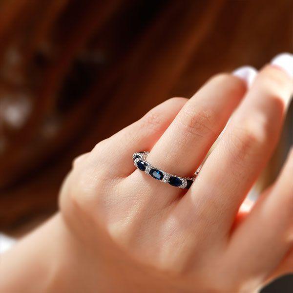 Oval Created Sapphire Wedding Band in Sterling Silver