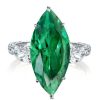 Emerald Cut Green Stone 3 Stone Engagement Ring in Rhodium Plated Sterling Silver
