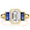 Golden Bezel Emerald Cut Three Stone Engagement Ring - 18K Gold Plated Sterling Silver