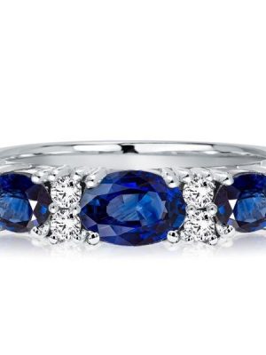 Oval Blue Sapphire Half Eternity Wedding Band in Rhodium-Plated Sterling Silver
