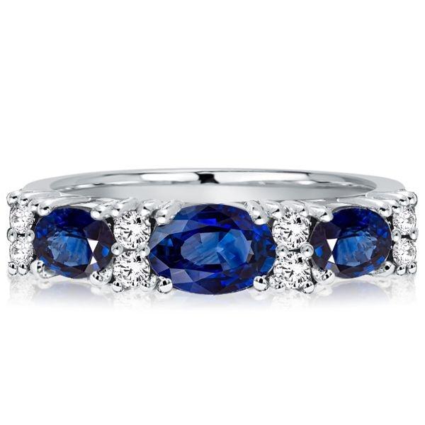Oval Blue Sapphire Half Eternity Wedding Band in Rhodium-Plated Sterling Silver