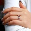 Round Cut Garnet Eternity Wedding Band in Rhodium Plated Sterling Silver