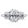 Three Stone Oval Created White Sapphire Engagement Ring in Rhodium Plated Sterling Silver