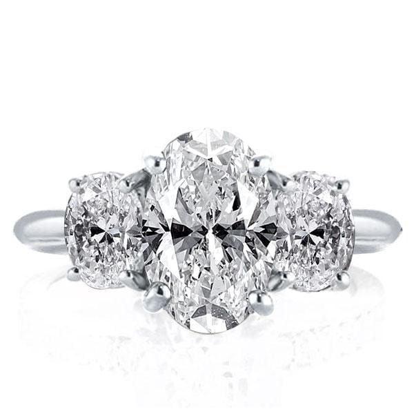 Three Stone Oval Created White Sapphire Engagement Ring in Rhodium Plated Sterling Silver