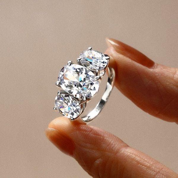Three Stone Oval Created White Sapphire Engagement Ring in Rhodium Plated Sterling Silver