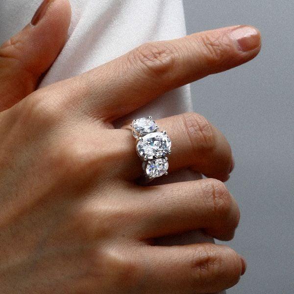 Three Stone Oval Created White Sapphire Engagement Ring in Rhodium Plated Sterling Silver