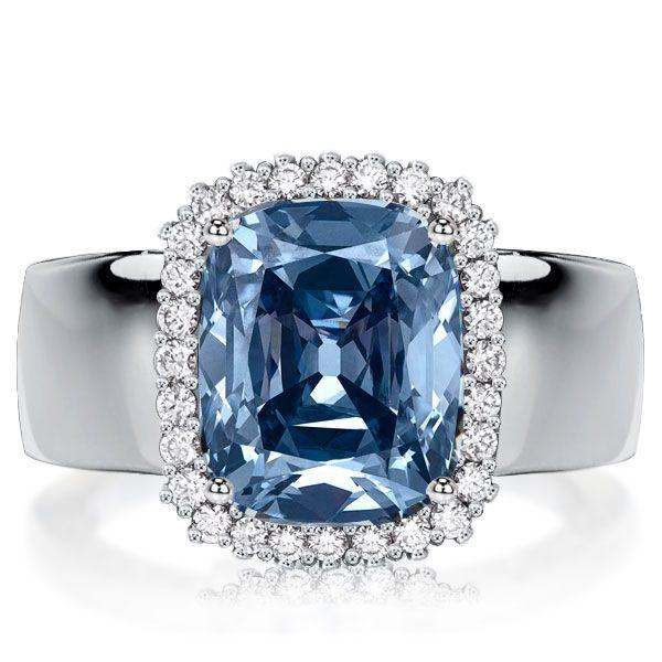 Cushion Cut Blue Topaz Halo Engagement Ring in Sterling Silver