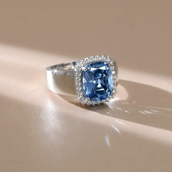 Cushion Cut Blue Topaz Halo Engagement Ring in Sterling Silver