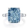 Three Stone Radiant Cut Blue Topaz Engagement Ring in Sterling Silver