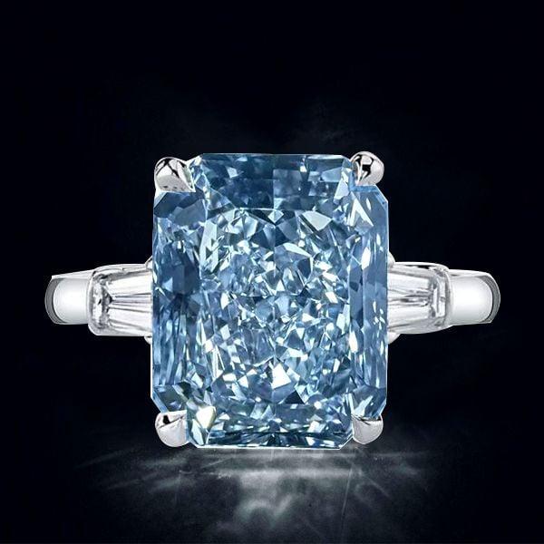 Three Stone Radiant Cut Blue Topaz Engagement Ring in Sterling Silver
