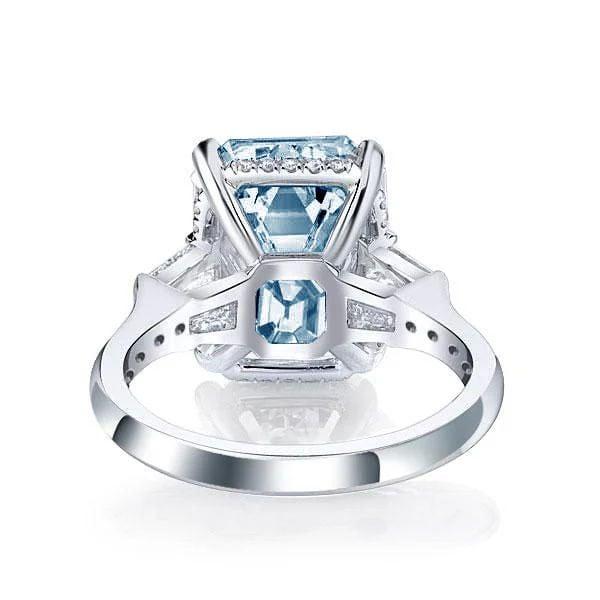 Three Stone Radiant Cut Blue Topaz Engagement Ring in Sterling Silver