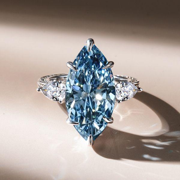 Three Stone Marquise Cut Blue Simulated Sapphire Engagement Ring in Sterling Silver